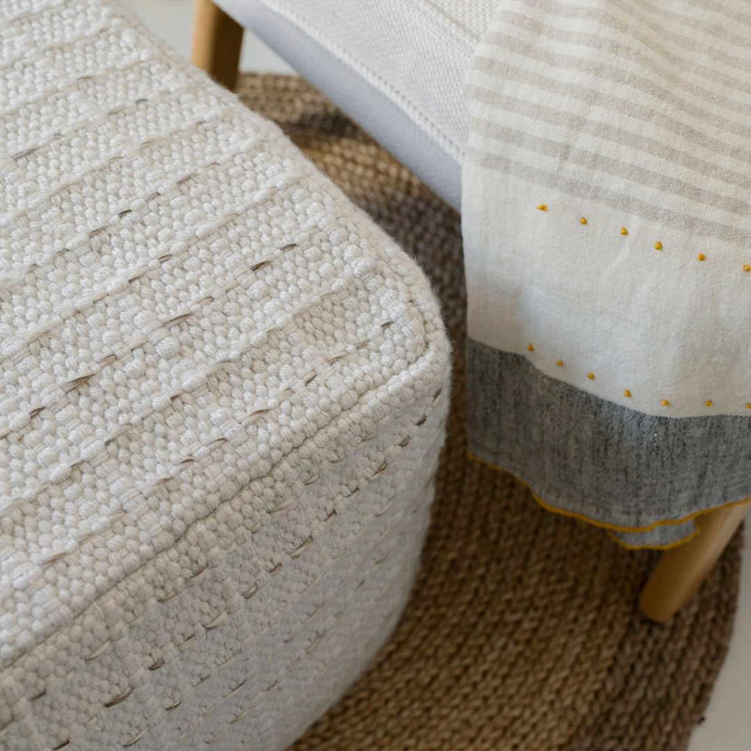 Square striped woven pouf side angle