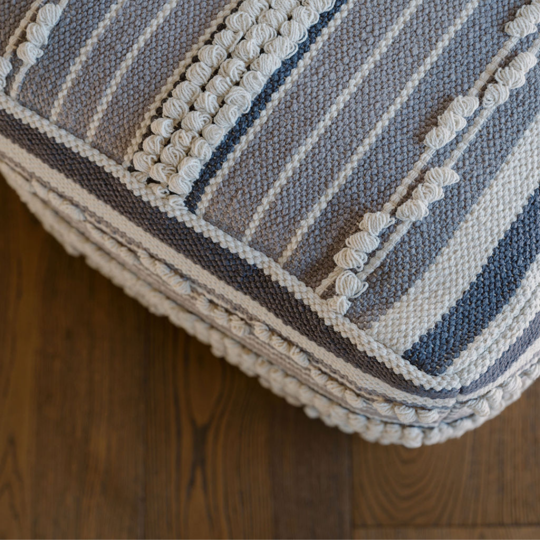 Striped loop ottoman pouf in room setting